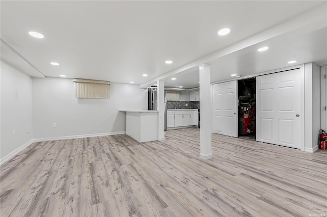 unfurnished living room with light wood-type flooring