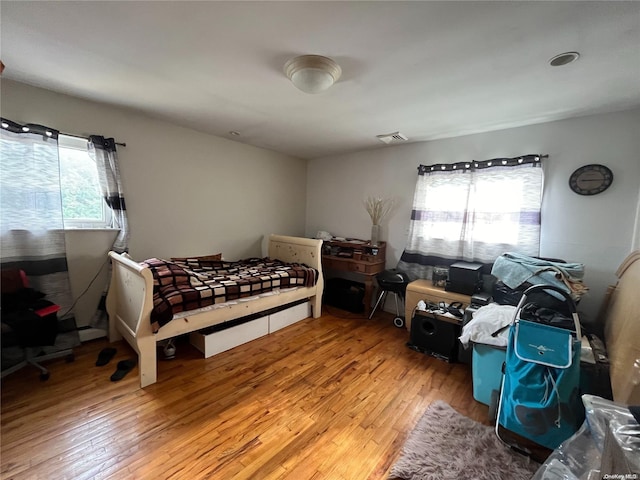 bedroom with light hardwood / wood-style floors