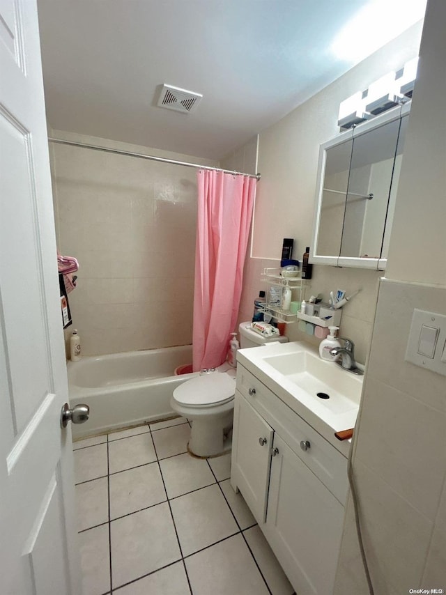 full bathroom with tile patterned floors, vanity, toilet, and shower / tub combo with curtain