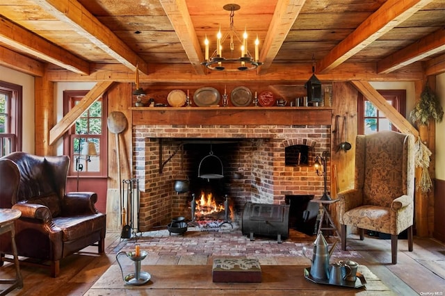 living area with wooden ceiling, hardwood / wood-style floors, beamed ceiling, and a chandelier