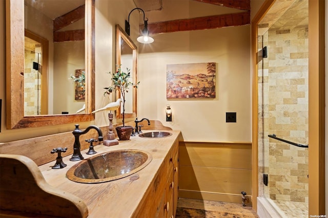 bathroom with vanity and a shower with door