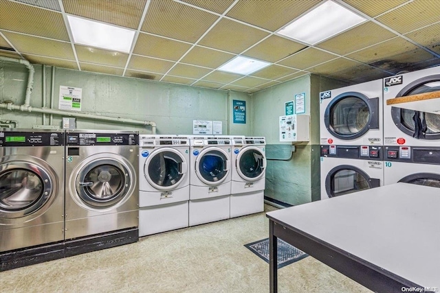 laundry room featuring washing machine and dryer and stacked washer and dryer