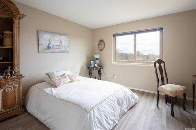 bedroom with light wood-type flooring