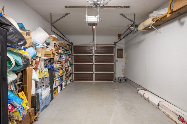 garage featuring a garage door opener and electric panel