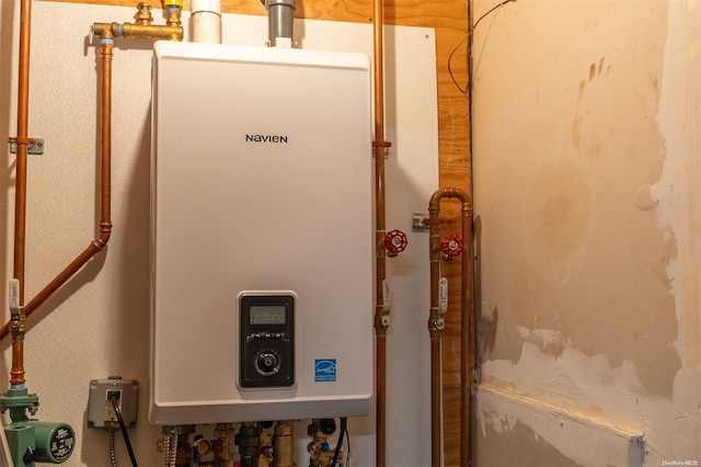 utility room featuring water heater