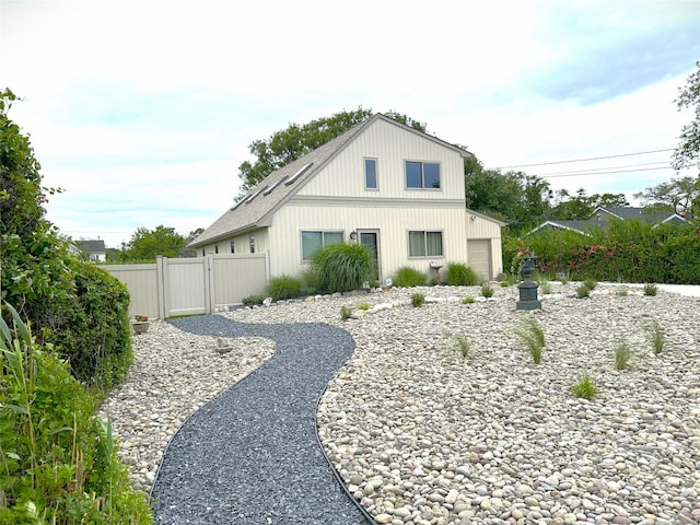 304 S Dunton Ave, East Patchogue, NY 11772 - view of property exterior featuring a gate and a garage