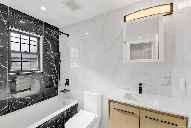 full bathroom with vanity, tiled shower / bath, and tile walls