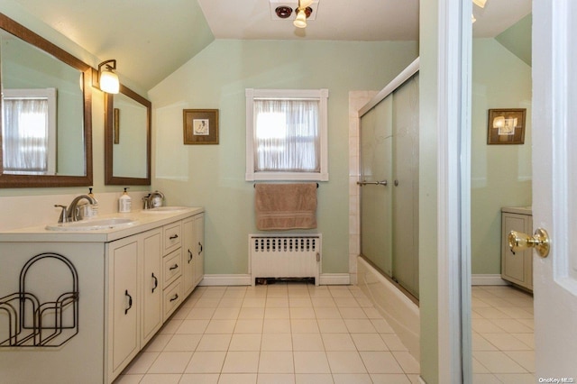 bathroom with shower / bath combination with glass door, radiator, tile patterned floors, and lofted ceiling