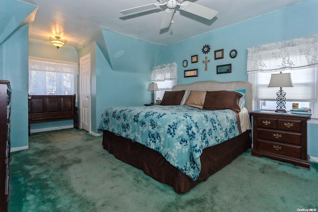 carpeted bedroom with vaulted ceiling and ceiling fan