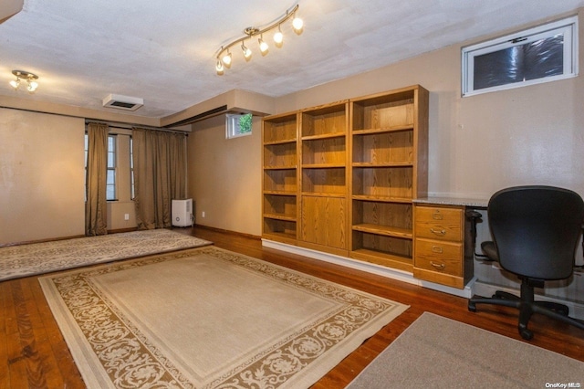 office space with dark hardwood / wood-style flooring and a textured ceiling