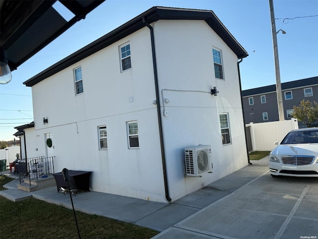 view of home's exterior with ac unit