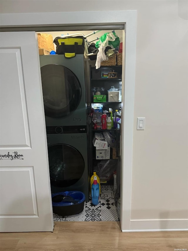 pantry with stacked washer / dryer