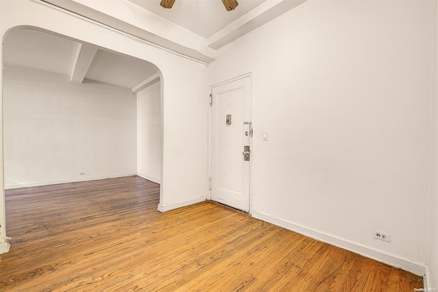 unfurnished room with ceiling fan and wood-type flooring