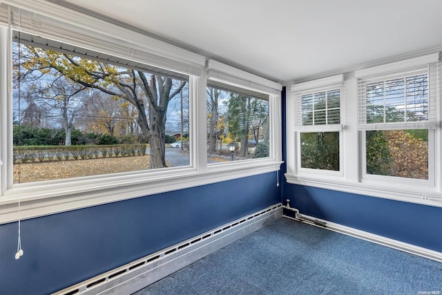 unfurnished sunroom featuring a baseboard radiator