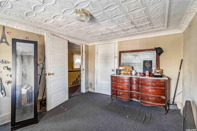 carpeted bedroom with ornamental molding