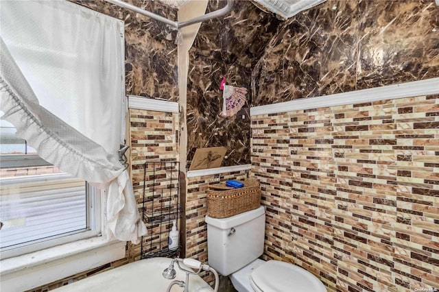 bathroom with a bathing tub and toilet