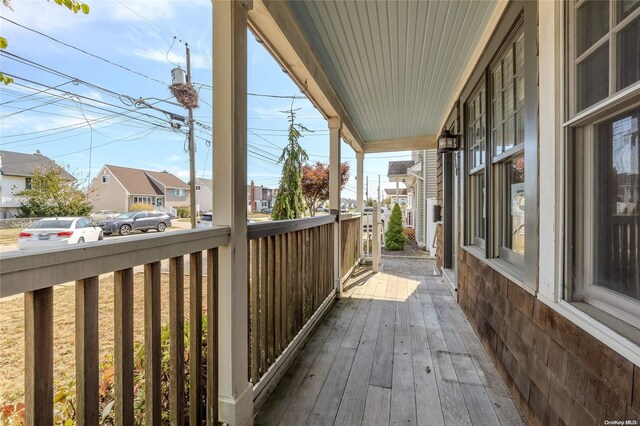 wooden terrace with a porch