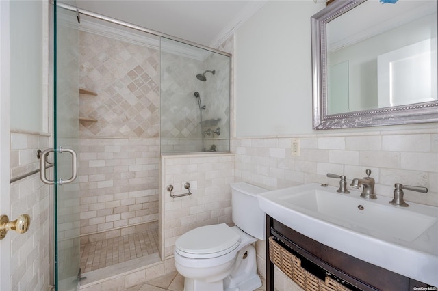 bathroom with vanity, toilet, ornamental molding, tile walls, and an enclosed shower