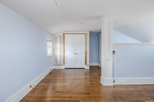 bonus room with dark hardwood / wood-style floors and lofted ceiling