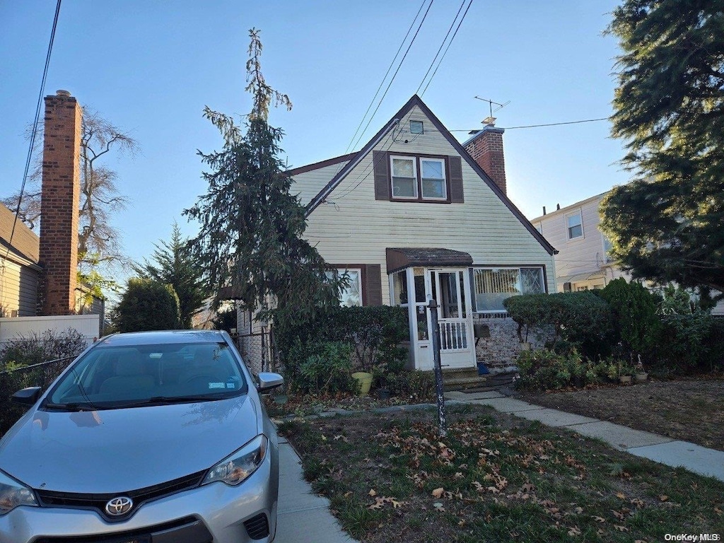 206 W Marshall St, Hempstead, NY 11550 - bungalow-style house with a chimney