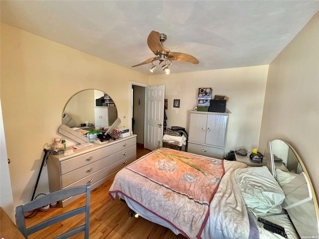 bedroom with hardwood / wood-style floors and ceiling fan