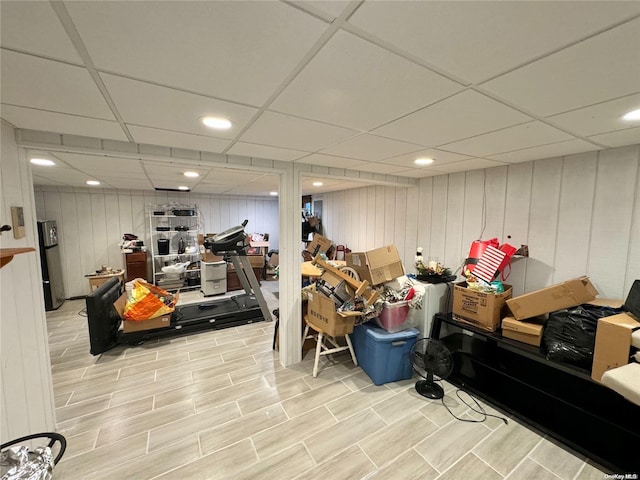 basement featuring a paneled ceiling