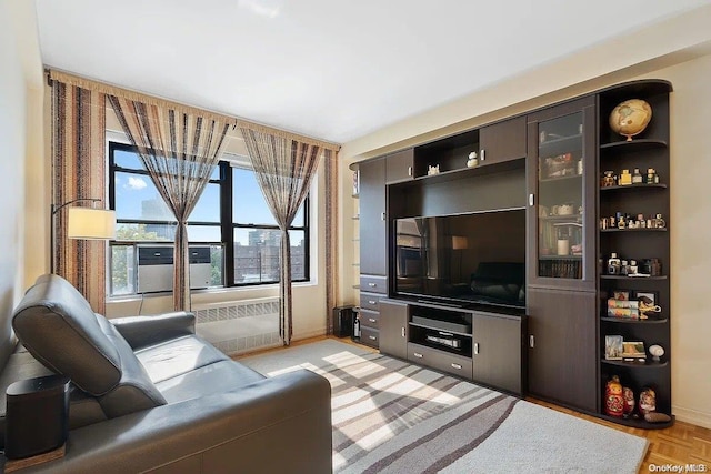 living room featuring light parquet floors and cooling unit