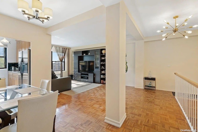 dining room with parquet floors and a notable chandelier