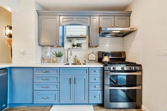 kitchen with tasteful backsplash, sink, and stainless steel appliances