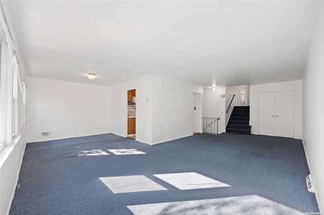 unfurnished living room with carpet floors