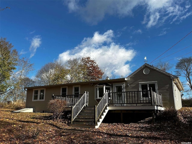 2468 River Rd, Calverton, NY 11933 - rear view of house featuring a wooden deck