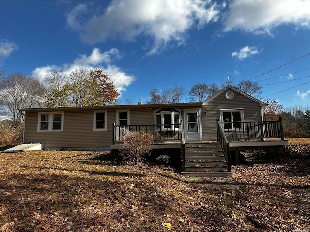 2468 River Rd, Calverton, NY 11933 - rear view of house with a wooden deck