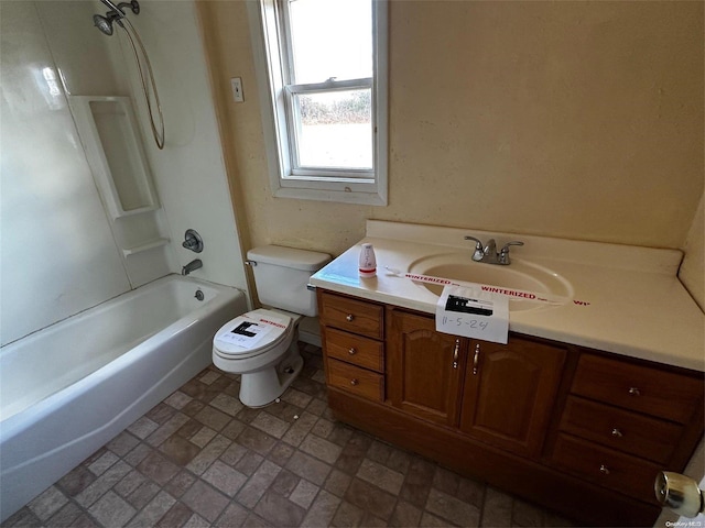 full bathroom featuring shower / bathing tub combination, vanity, and toilet