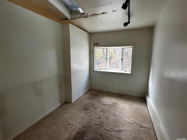 empty room featuring carpet flooring