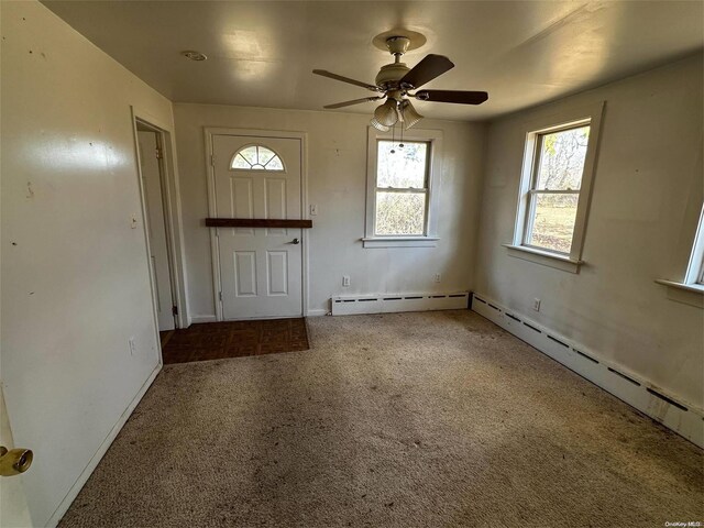 2468 River Rd, Calverton, NY 11933 - carpeted entrance foyer with a ceiling fan and baseboards