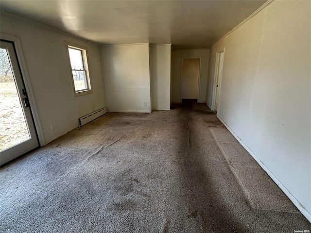 unfurnished room featuring carpet and baseboard heating