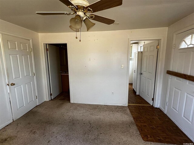 2468 River Rd, Calverton, NY 11933 - unfurnished bedroom featuring ceiling fan and carpet
