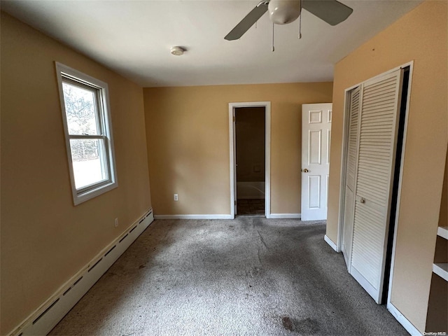 unfurnished bedroom featuring a closet, a baseboard radiator, dark carpet, and ceiling fan