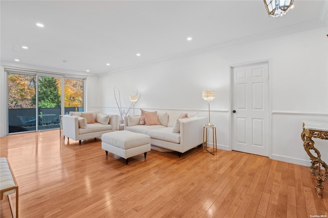 living room featuring crown molding and light hardwood / wood-style floors