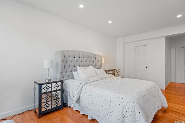 bedroom with wood-type flooring