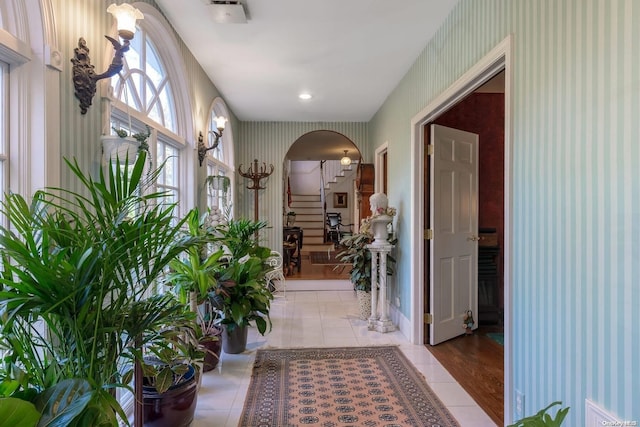 hall featuring light tile patterned flooring