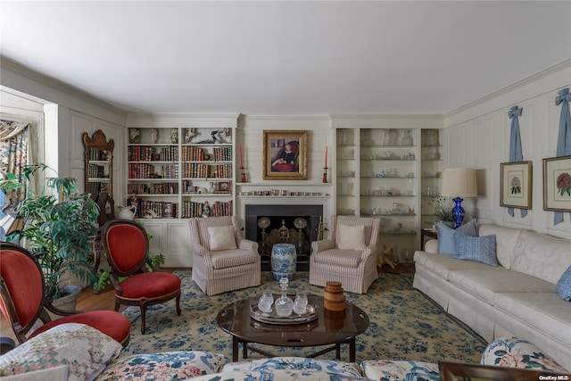 living room featuring ornamental molding and built in features