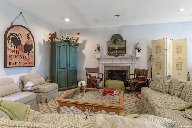 living room featuring a brick fireplace