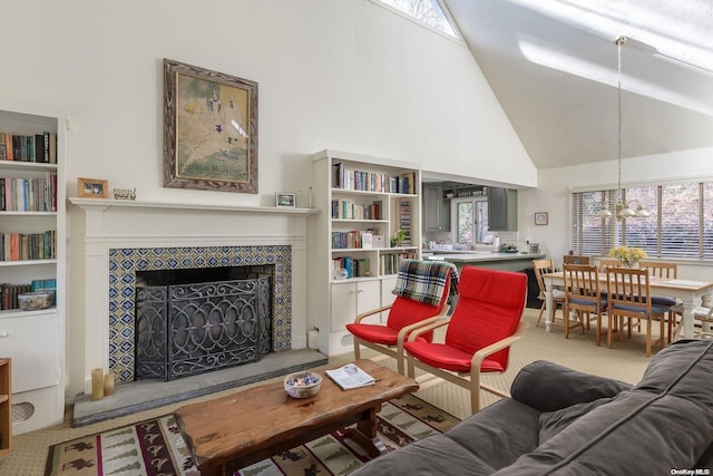 living room featuring high vaulted ceiling and a tiled fireplace