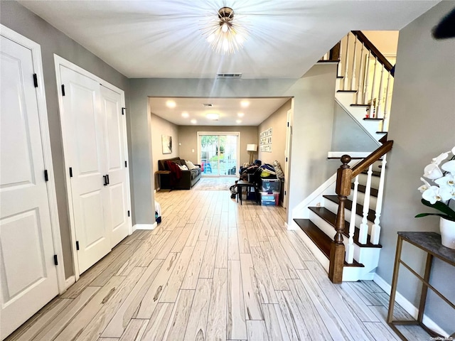 hallway with light wood-type flooring