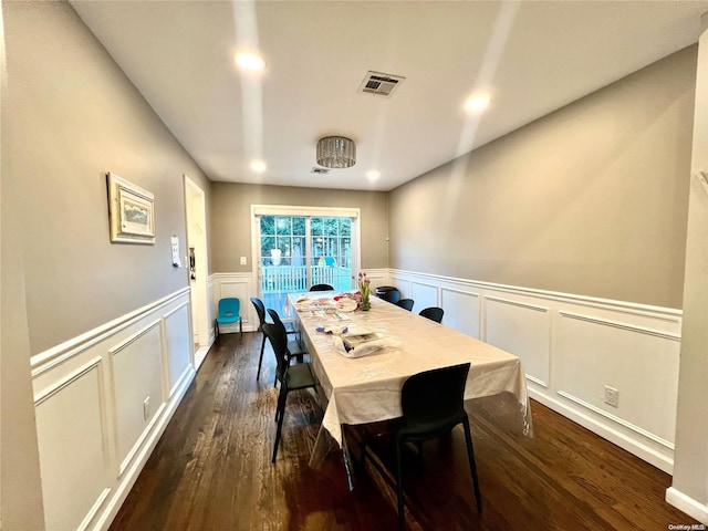 dining space featuring dark hardwood / wood-style floors