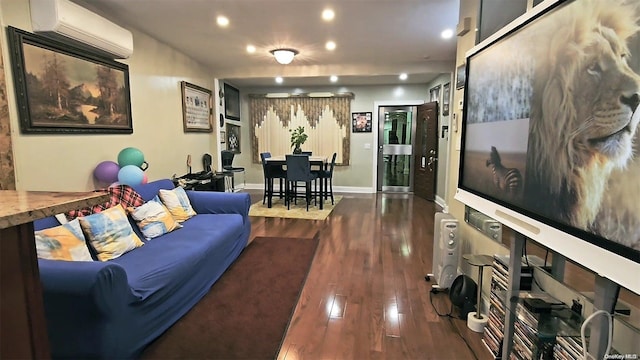 living room with a wall unit AC and dark wood-type flooring