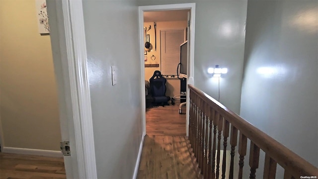 hallway with dark hardwood / wood-style floors