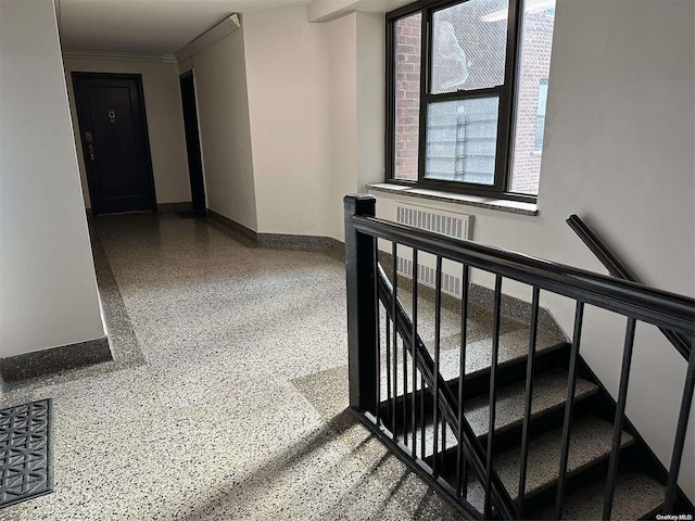 staircase featuring crown molding