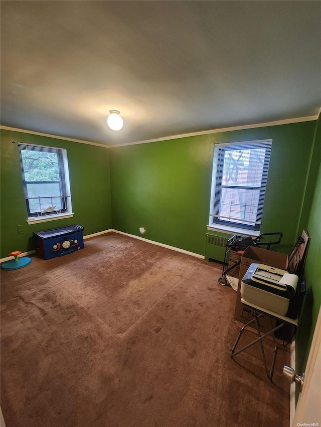 interior space featuring crown molding and carpet floors